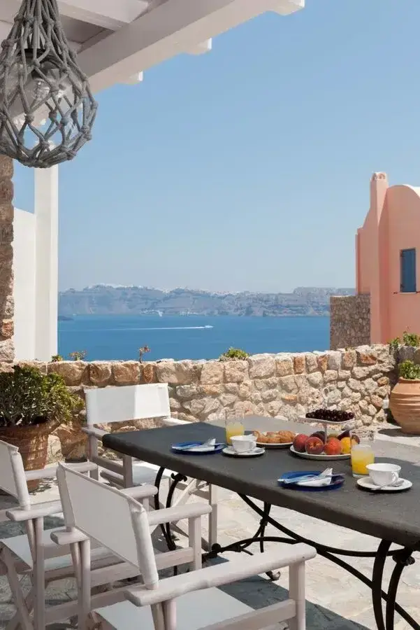 Cave-style exterior of Black Gem Villa in Akrotiri, Santorini
