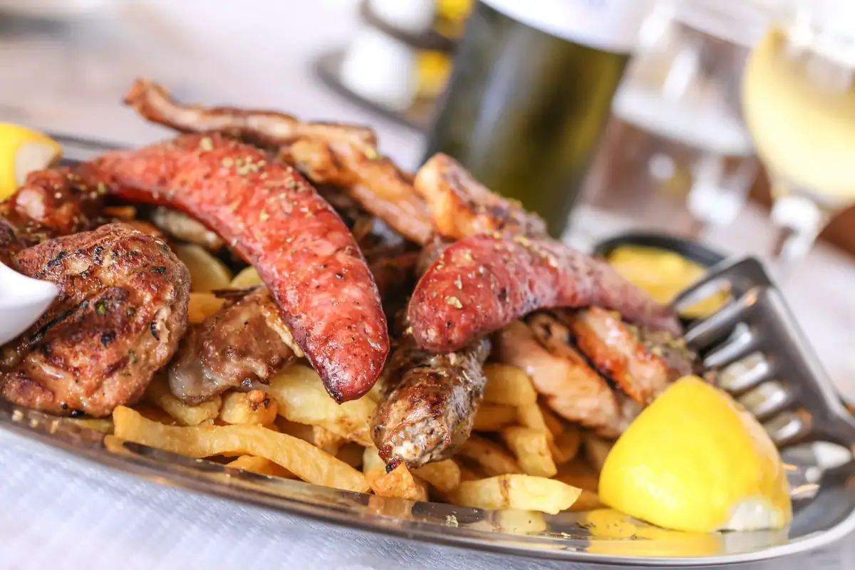 Grilled plate with Greek sides served at Fish Tavern O Perivolos